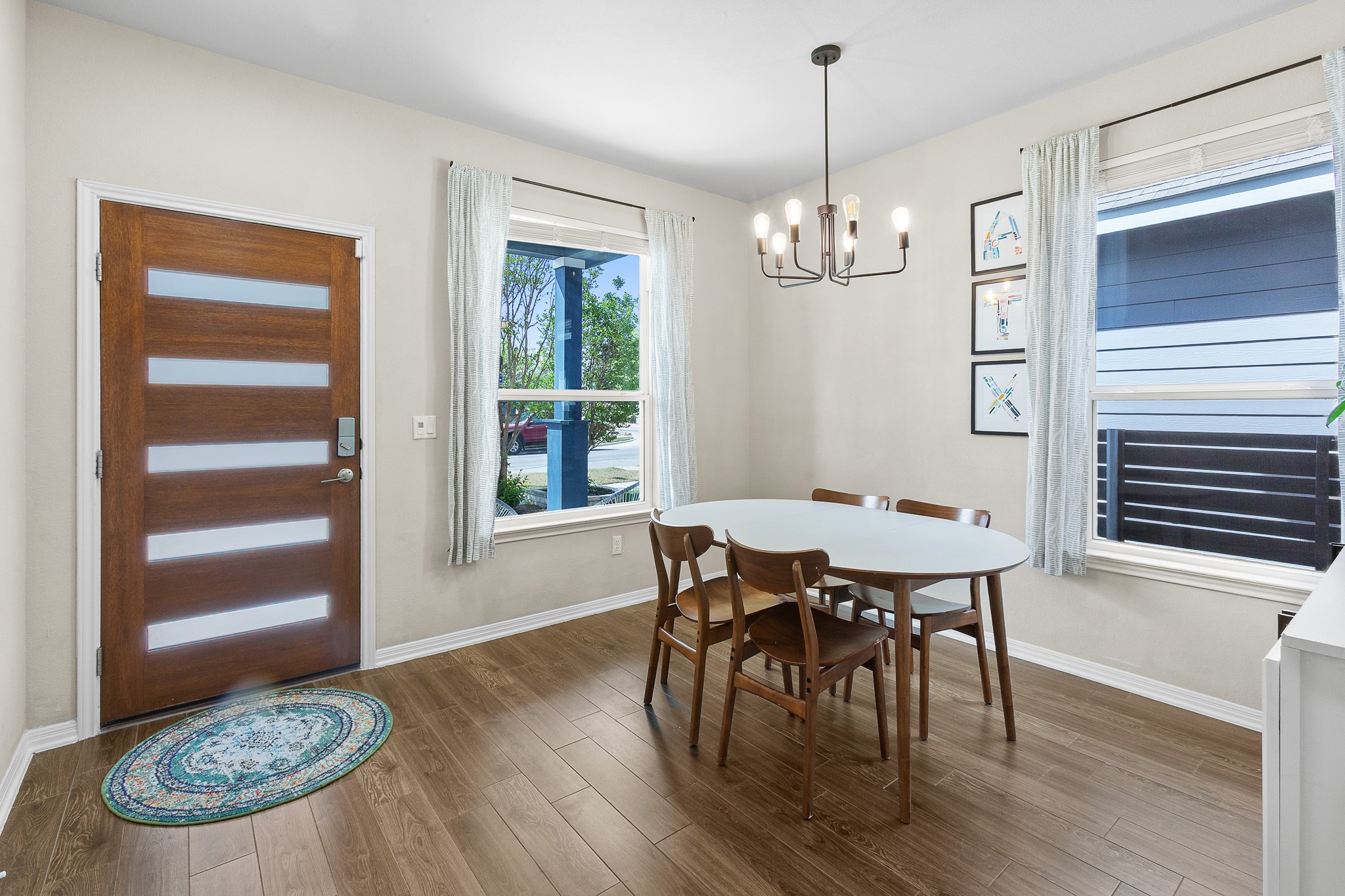 8916 Cattle Baron Path Austin, TX 78747 - Photo 6 of 37 a view of a dining room with furniture window and wooden floor