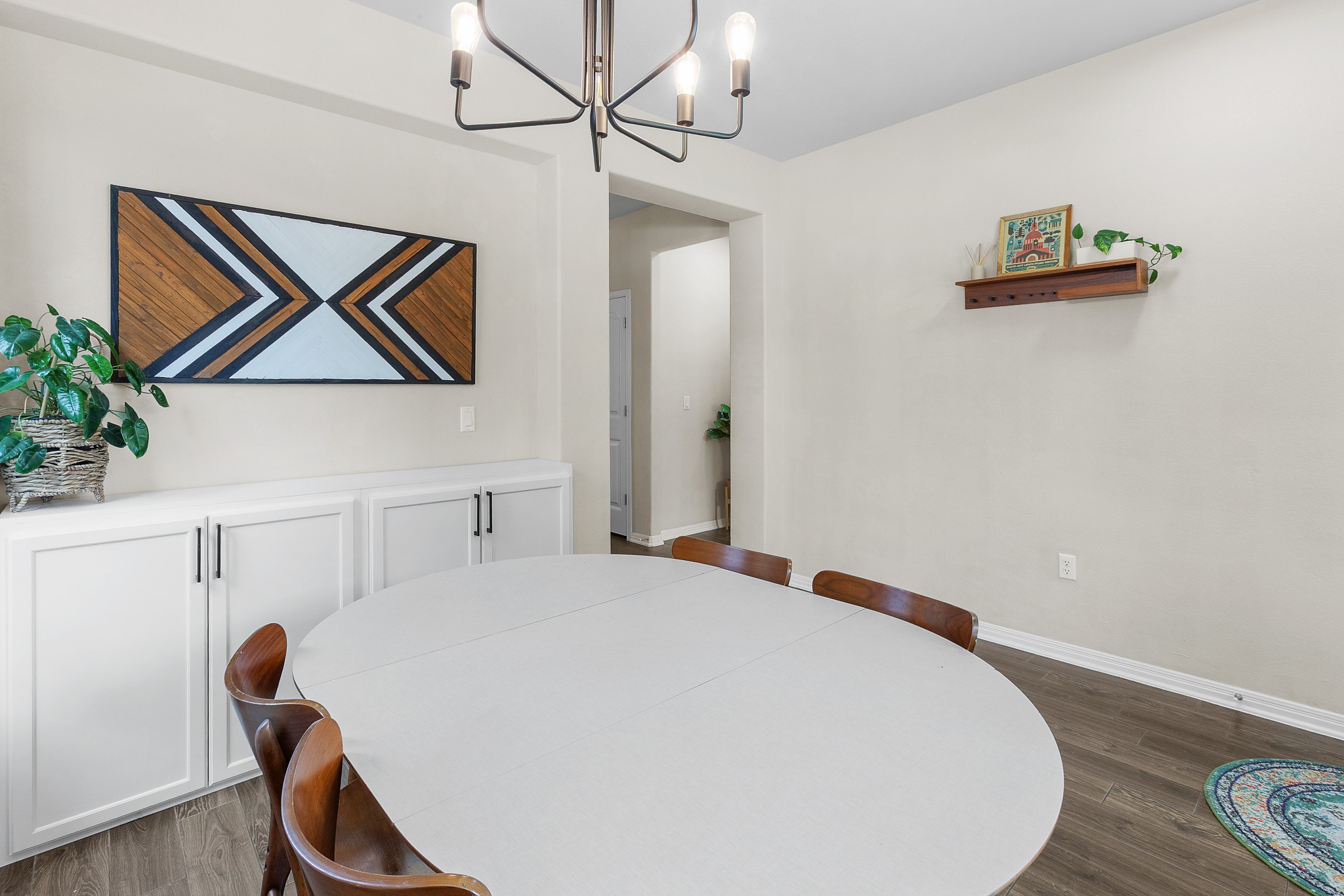 8916 Cattle Baron Path Austin, TX 78747 - Photo 7 of 37 a bedroom with a bed and a chandelier