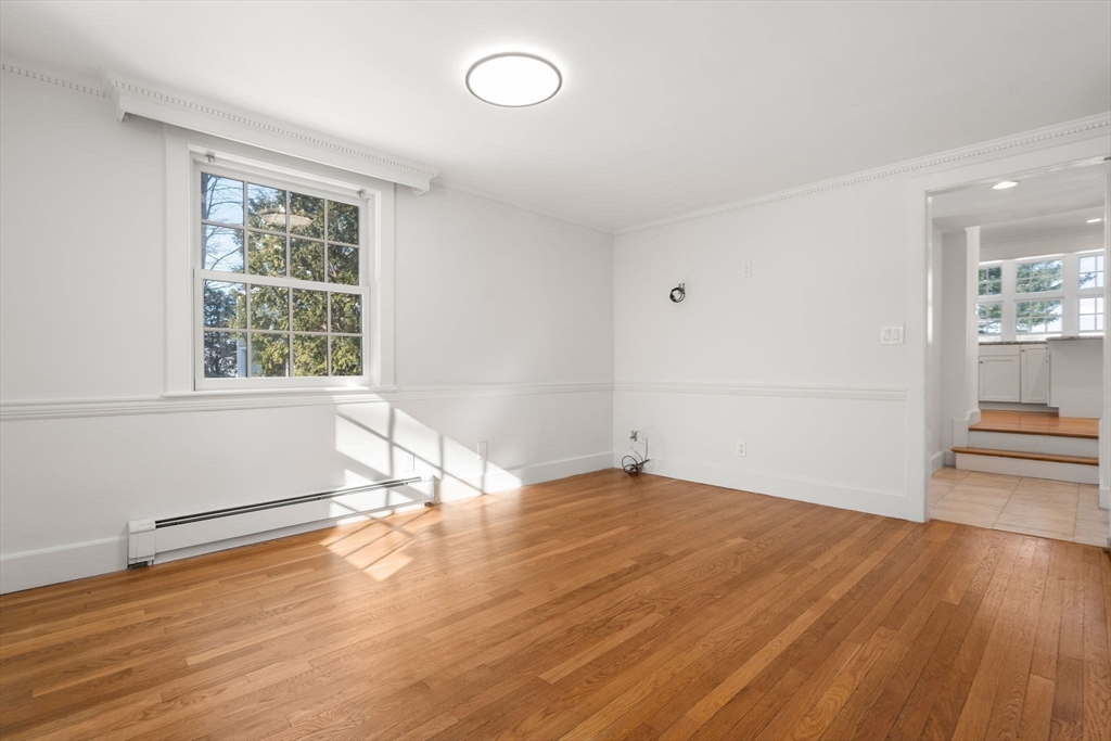 31 College Road Wellesley, MA 02482 - Photo 17 of 38 a view of empty room with wooden floor and fan