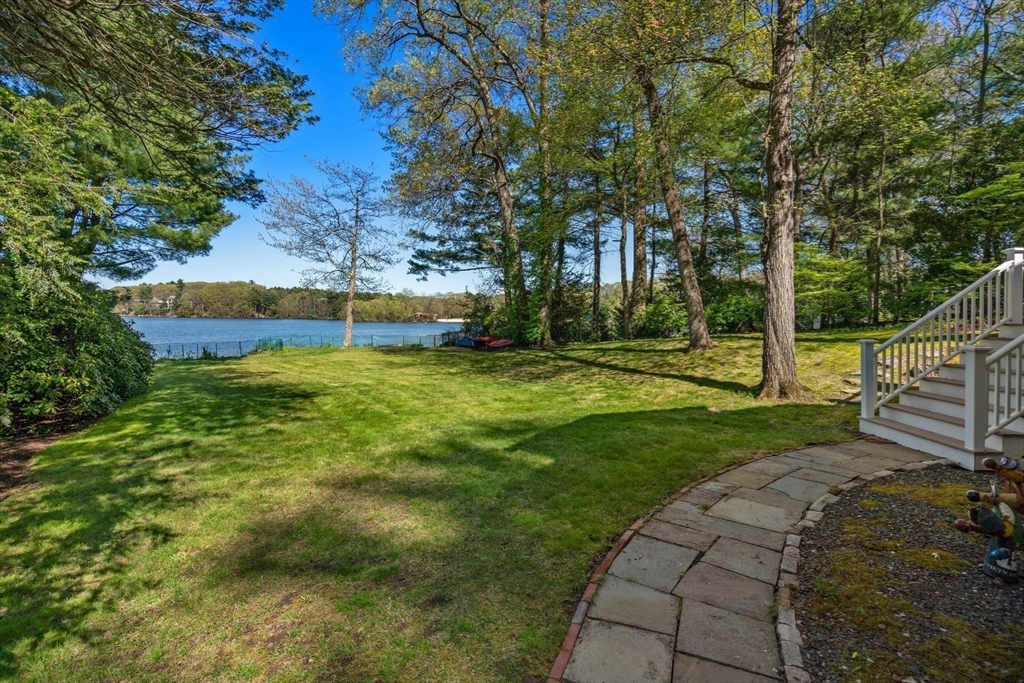 31 College Road Wellesley, MA 02482 - Photo 2 of 38 a view of a swimming pool with a garden
