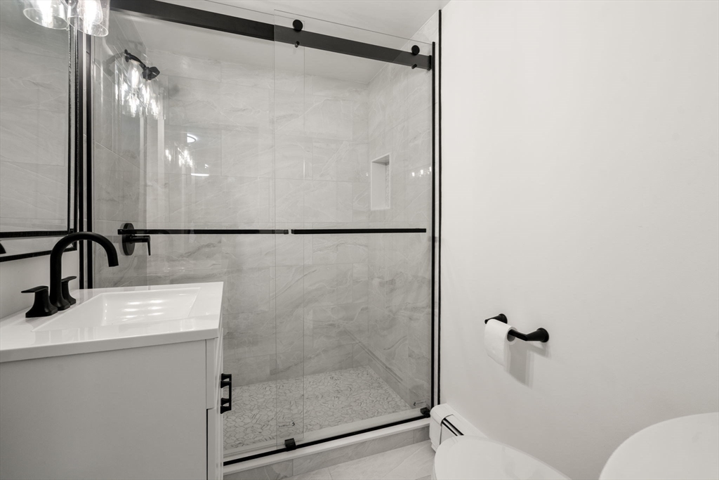 31 College Road Wellesley, MA 02482 - Photo 25 of 38 a bathroom with a shower and a sink