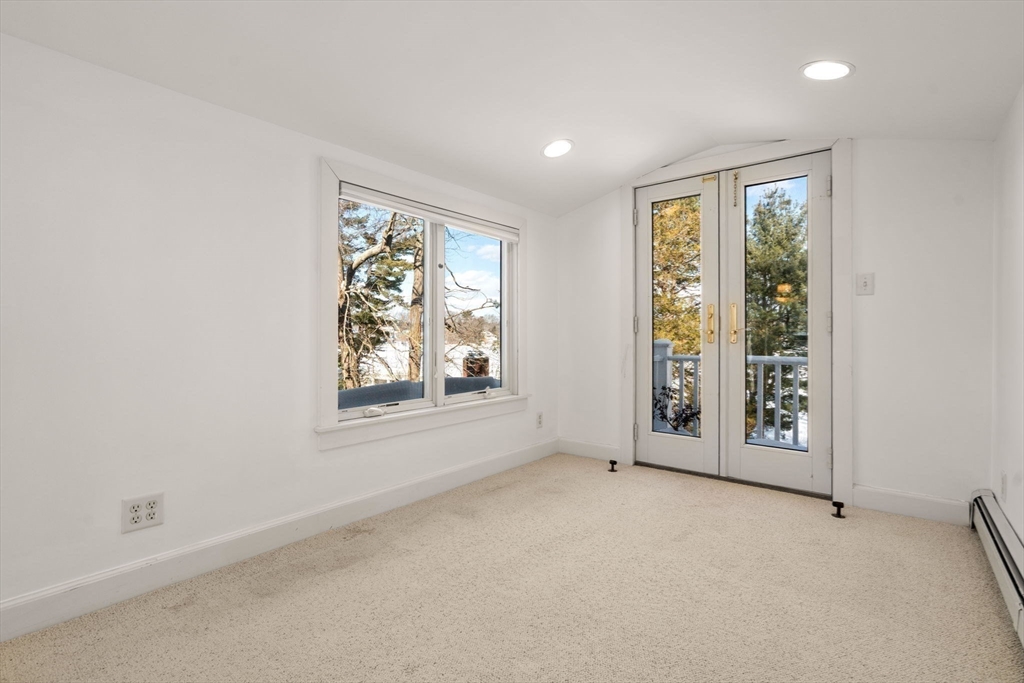31 College Road Wellesley, MA 02482 - Photo 29 of 38 an empty room with windows and closet