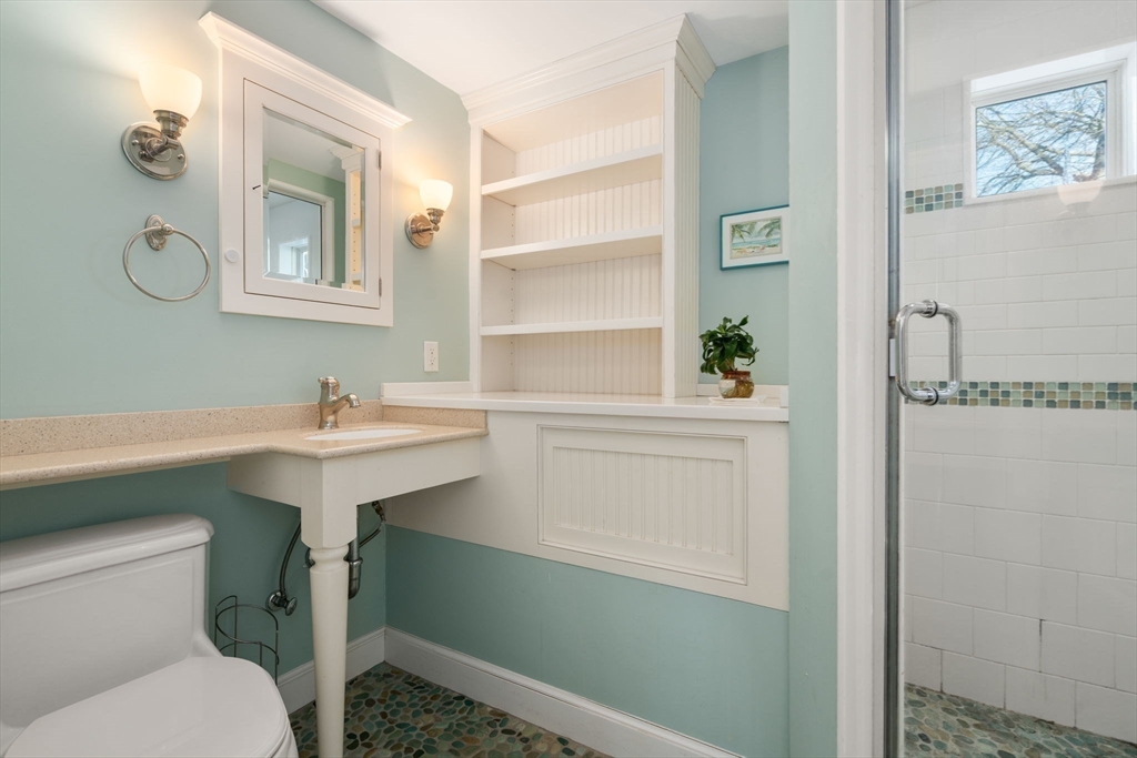 31 College Road Wellesley, MA 02482 - Photo 30 of 38 a bathroom with a sink toilet and a mirror