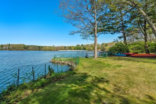 a view of a lake with houses in the back