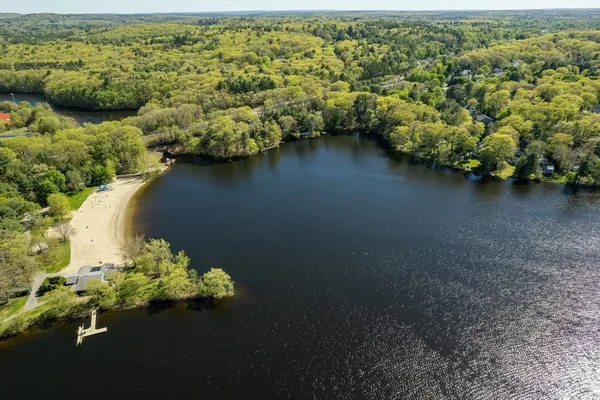 a view of a lake with a car parked