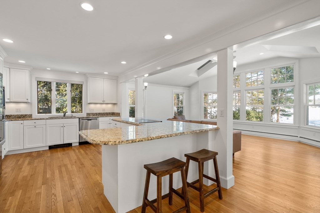 31 College Road Wellesley, MA 02482 - Photo 6 of 38 a large kitchen with kitchen island a large island in it