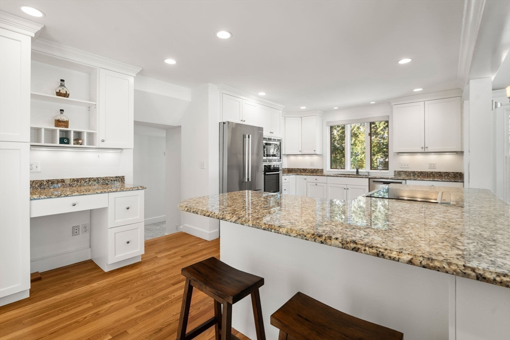 31 College Road Wellesley, MA 02482 - Photo 9 of 38 a kitchen with white cabinets and appliances