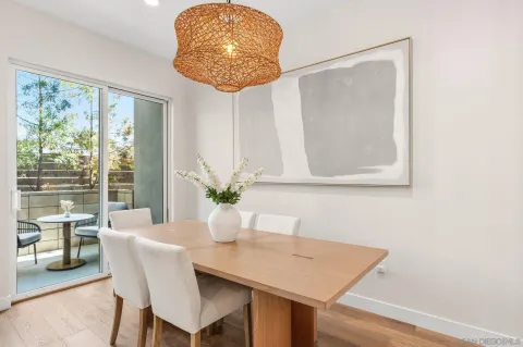 a view of a dining table and chairs in a room