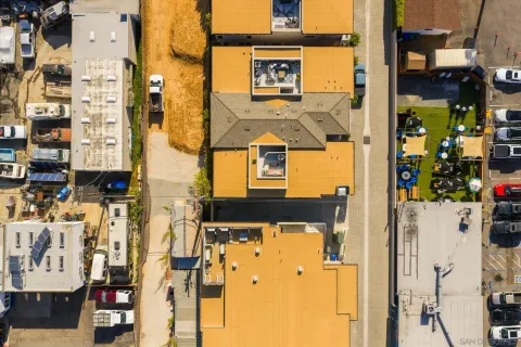 an aerial view of residential building and ocean