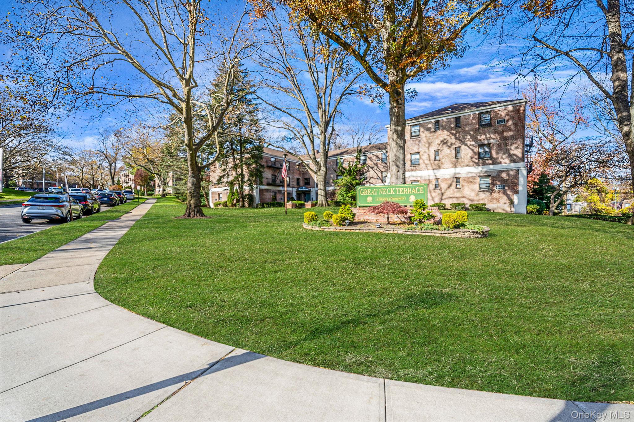 a front view of a building with garden