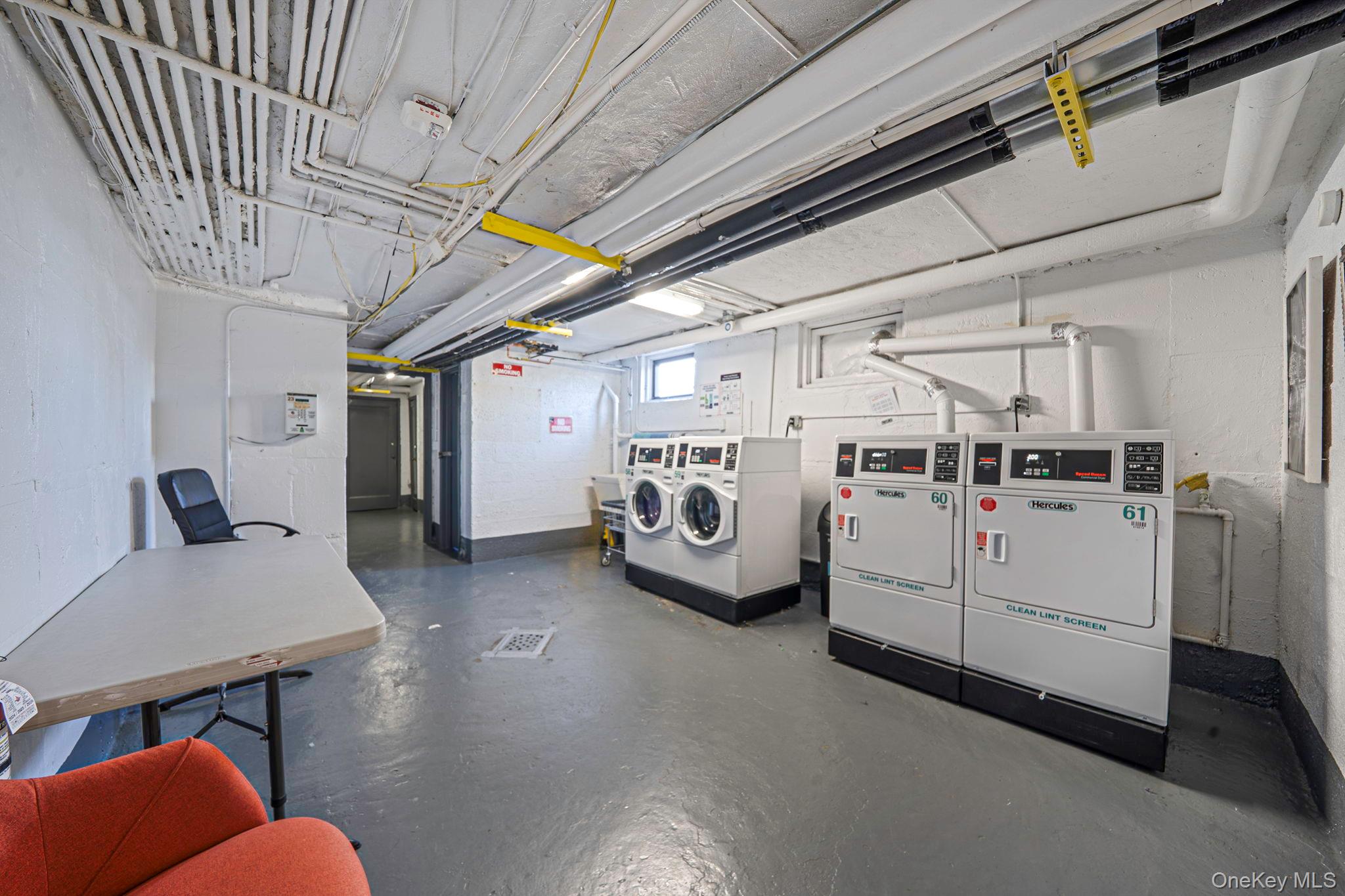 8 Terrace Circle, Unit 1G Great Neck, NY 11021 - Photo 13 of 17 a utility room with dryer and washer