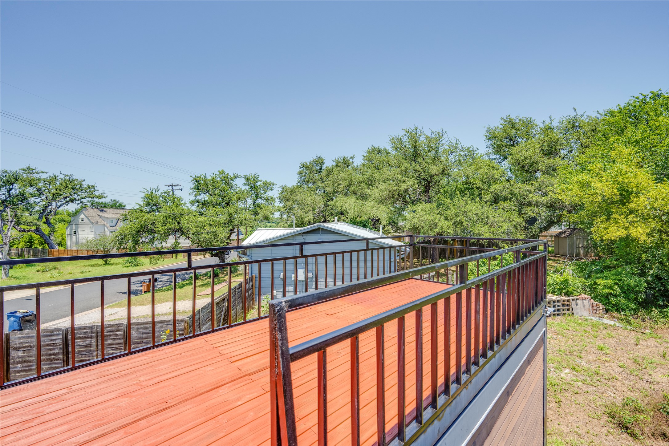 1707 Overhill Drive Austin, TX 78721 - Photo 24 of 36 An elevated wood deck provides a pleasant outdoor space for relaxation or entertaining.