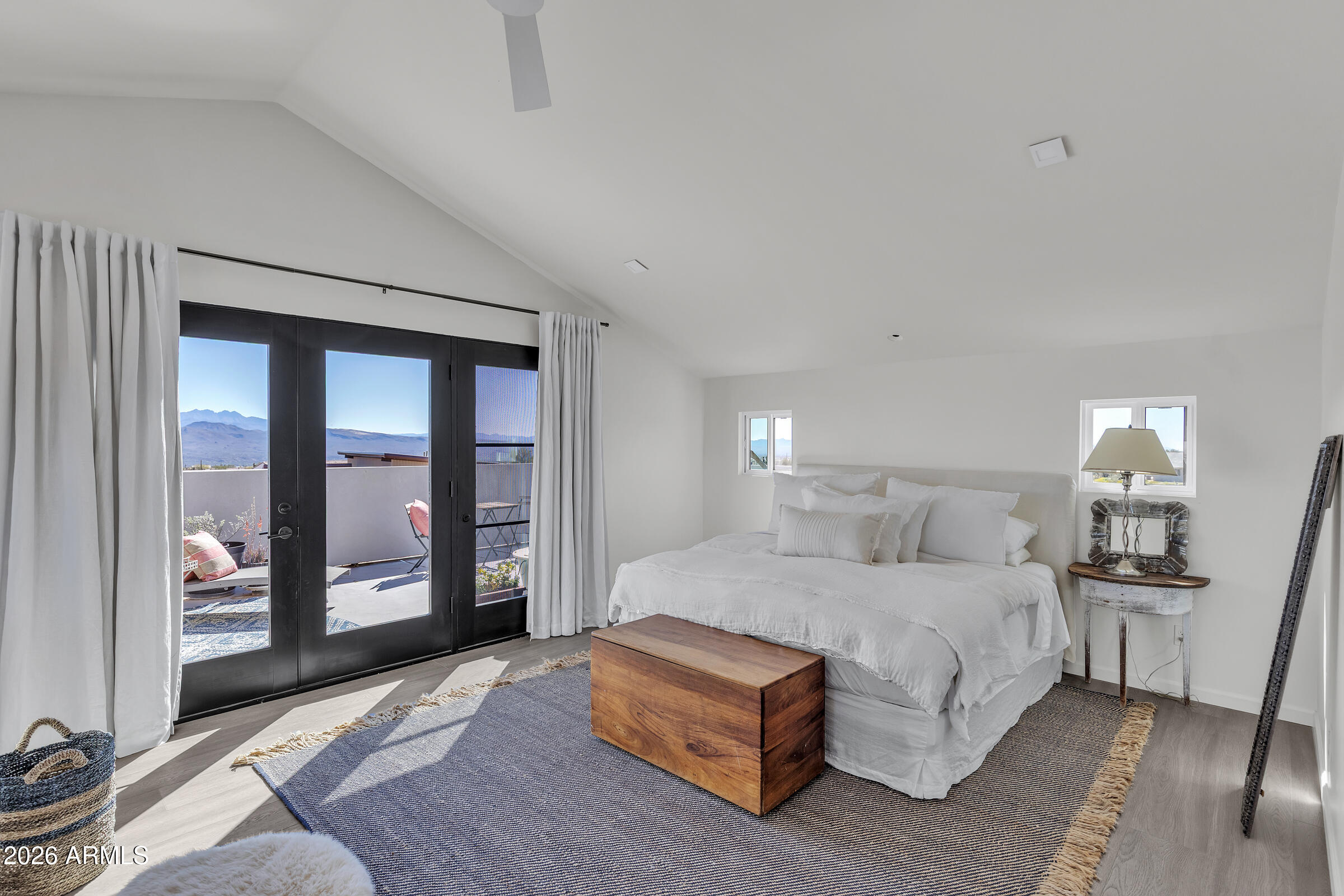 16705 East Ranch Road Scottsdale, AZ 85262 - Photo 25 of 53 a bedroom with a large bed and a night stand