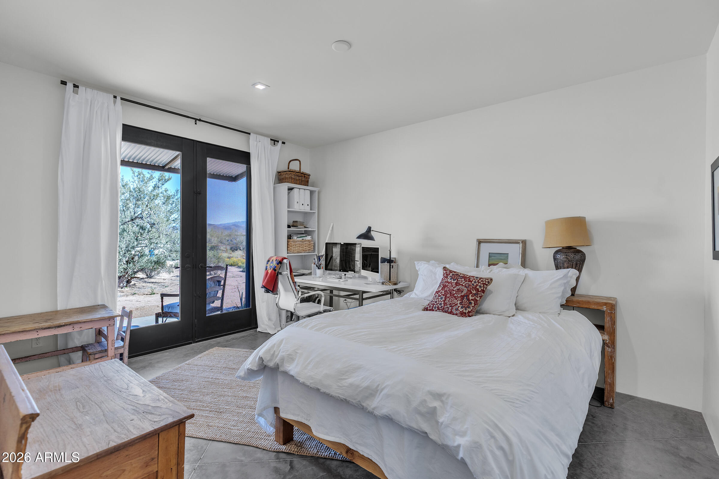 16705 East Ranch Road Scottsdale, AZ 85262 - Photo 32 of 53 a bedroom with a large bed and a large window