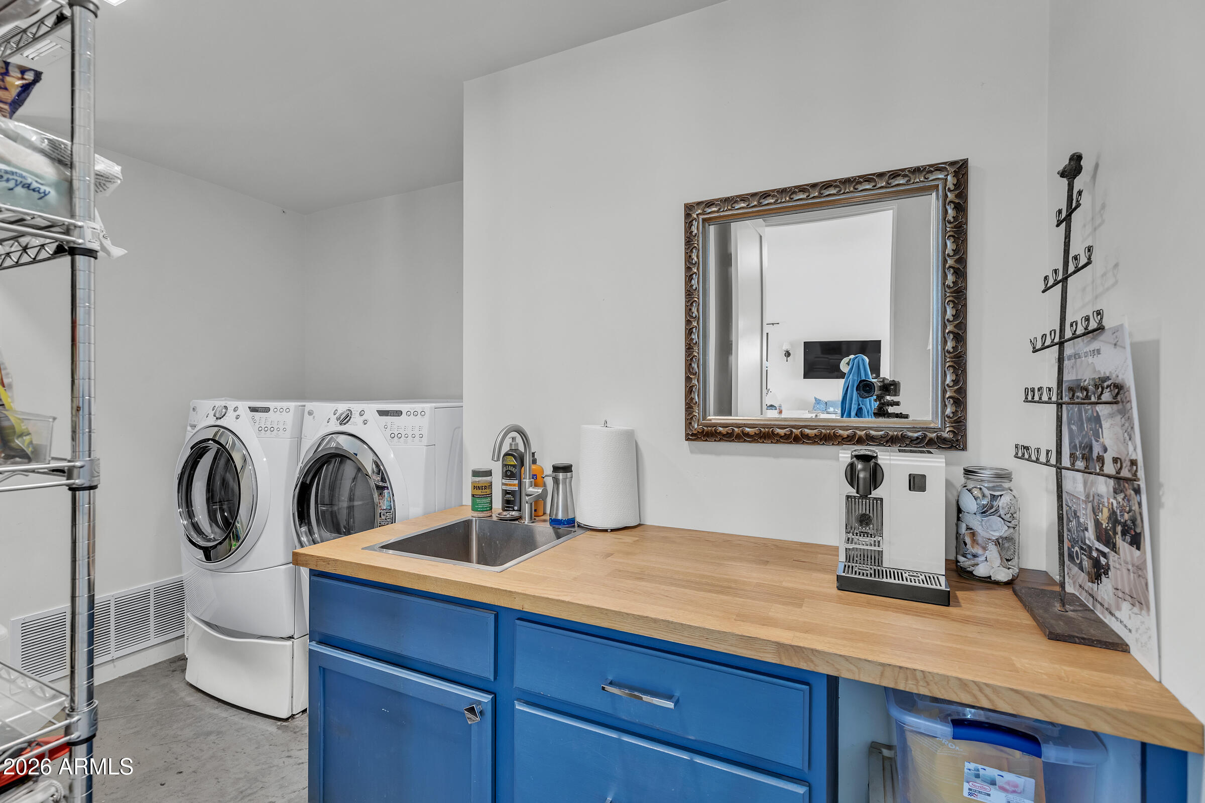 16705 East Ranch Road Scottsdale, AZ 85262 - Photo 42 of 53 a bathroom with a sink a washer and dryer