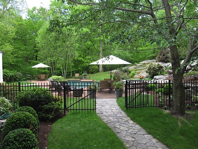 207 Jonathan Road New Canaan, CT 06840 - Photo 28 of 30 a view of a chair and table in the garden
