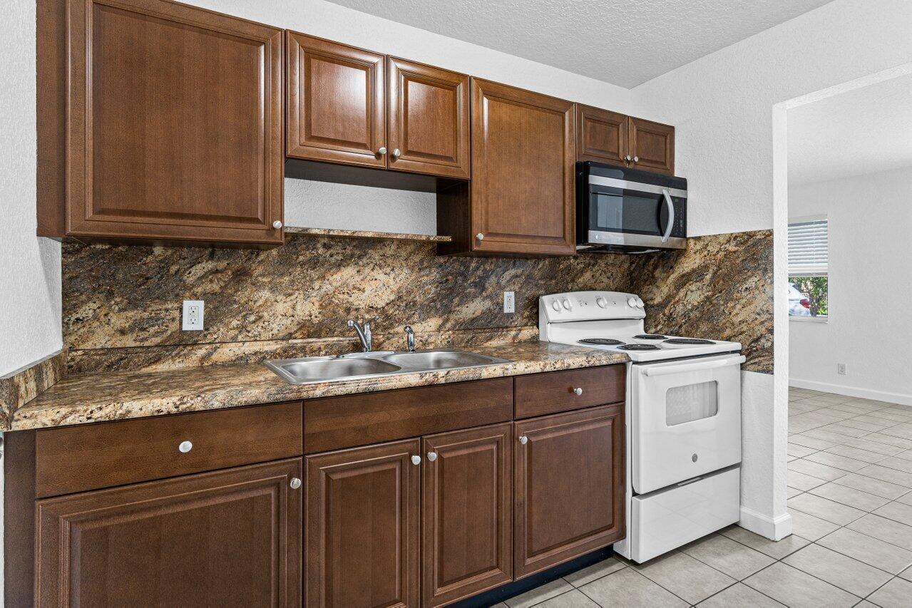 751 Hummingbird Way, Unit 1 North Palm Beach, FL 33408 - Photo 1 of 22 005-751HummingbirdWay-Unit1-NorthPalmBea