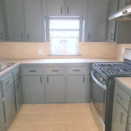a bathroom with a sink and a window