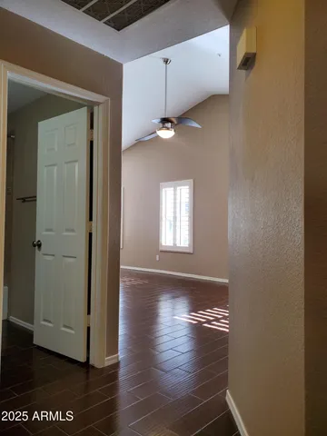 a view of an empty room with a window