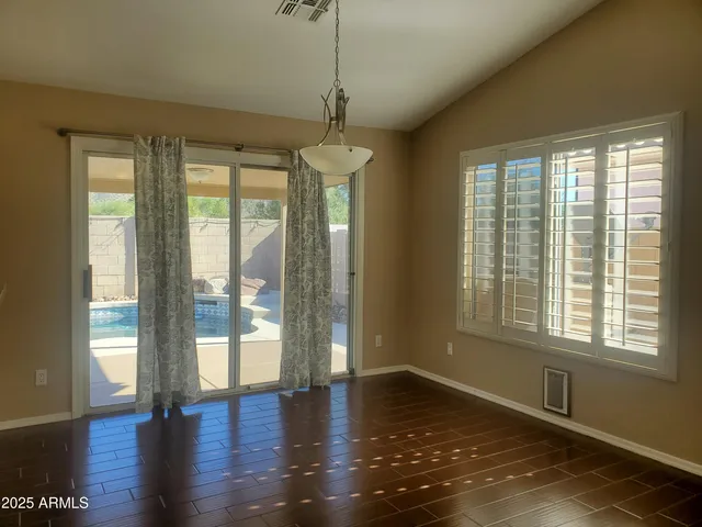 a kitchen with stainless steel appliances a refrigerator and a stove