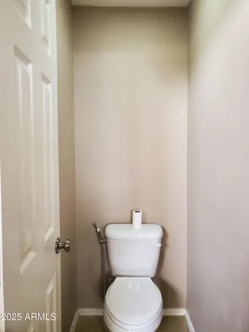 a view of a dry yard with trees