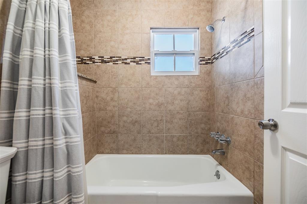 701 Poinsettia Road, Unit 306 Belleair, FL 33756 - Photo 11 of 25 a bathroom with a bathtub