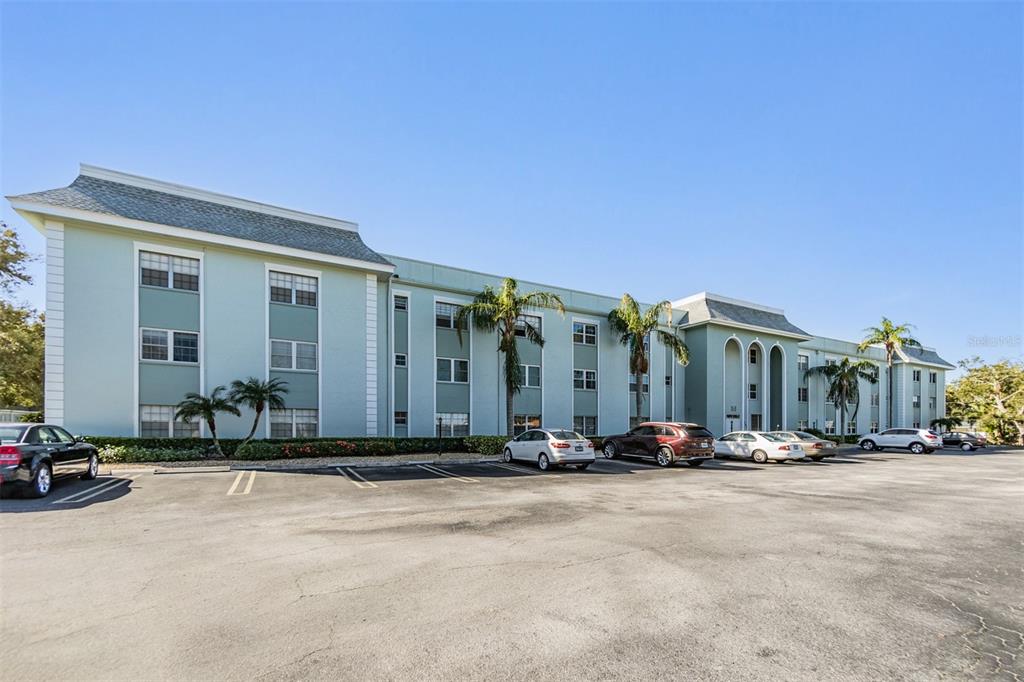 701 Poinsettia Road, Unit 306 Belleair, FL 33756 - Photo 22 of 25 a view of a building with cars parked in front of it