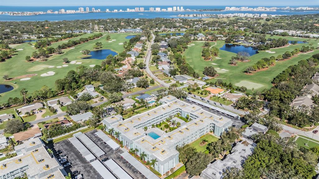 701 Poinsettia Road, Unit 306 Belleair, FL 33756 - Photo 25 of 25 an aerial view of residential houses with outdoor space