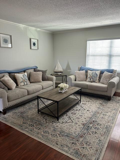 701 Poinsettia Road, Unit 306 Belleair, FL 33756 - Photo 8 of 25 a living room with furniture and a window