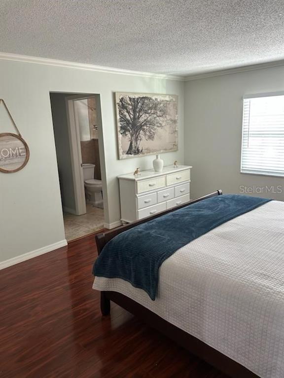 701 Poinsettia Road, Unit 306 Belleair, FL 33756 - Photo 10 of 25 a bedroom with a bed and a window