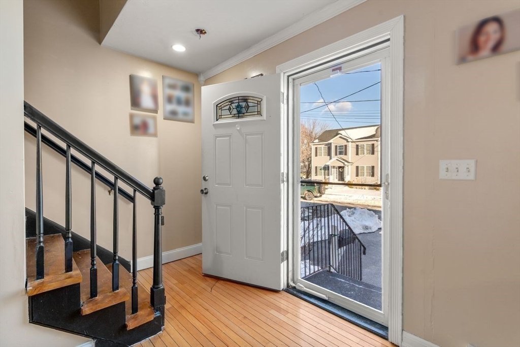 231 Lapham Street Fall River, MA 02721 - Photo 12 of 20 a view of entryway with wooden floor and stairs