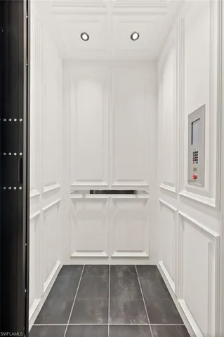 a roof deck with a table and chairs