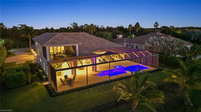 a view of a tennis ground with a mountain in the background