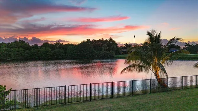 a living room with fireplace furniture and a flat screen tv