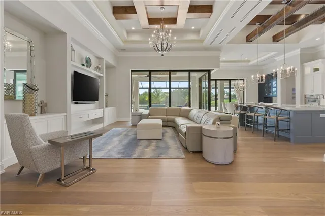 a view of a dining room with furniture large windows and wooden floor