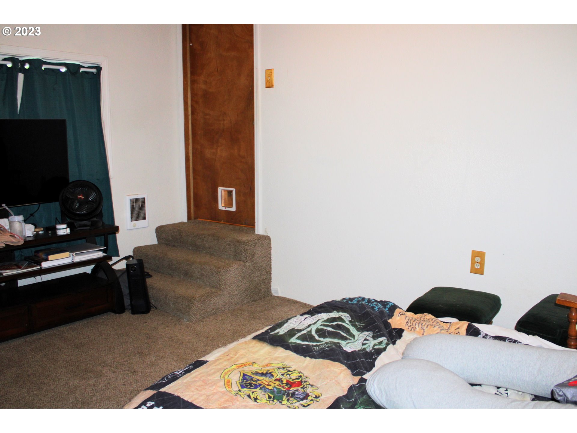 3392 Eagle Valley Road Yoncalla, OR 97499 - Photo 13 of 48 a bedroom with a bed and a flat screen tv