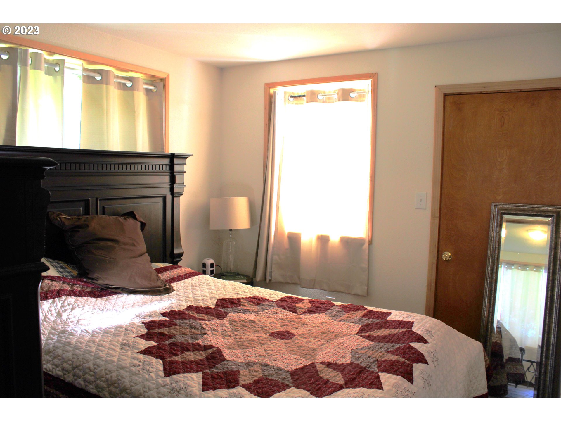 3392 Eagle Valley Road Yoncalla, OR 97499 - Photo 23 of 48 a bedroom with a bed and a window