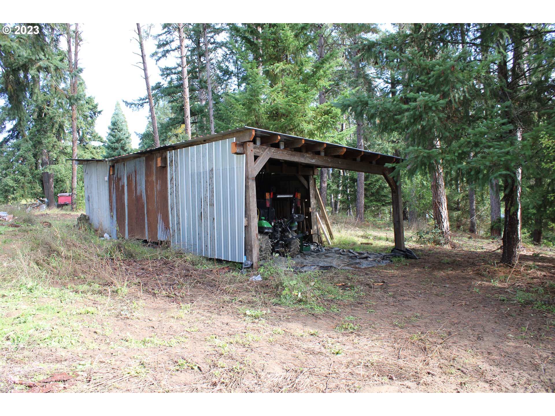 3392 Eagle Valley Road Yoncalla, OR 97499 - Photo 29 of 48 a view of a barn in the middle of a yard