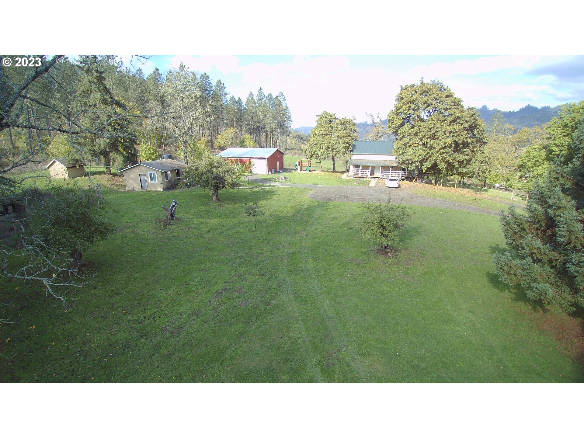 3392 Eagle Valley Road Yoncalla, OR 97499 - Photo 41 of 48 a open area with trees in the background