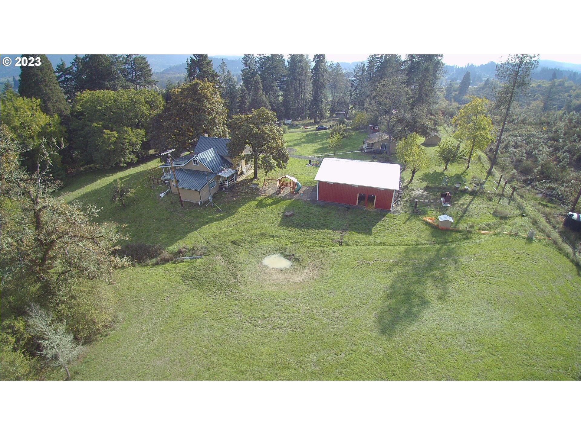 3392 Eagle Valley Road Yoncalla, OR 97499 - Photo 44 of 48 a aerial view of a house with a yard