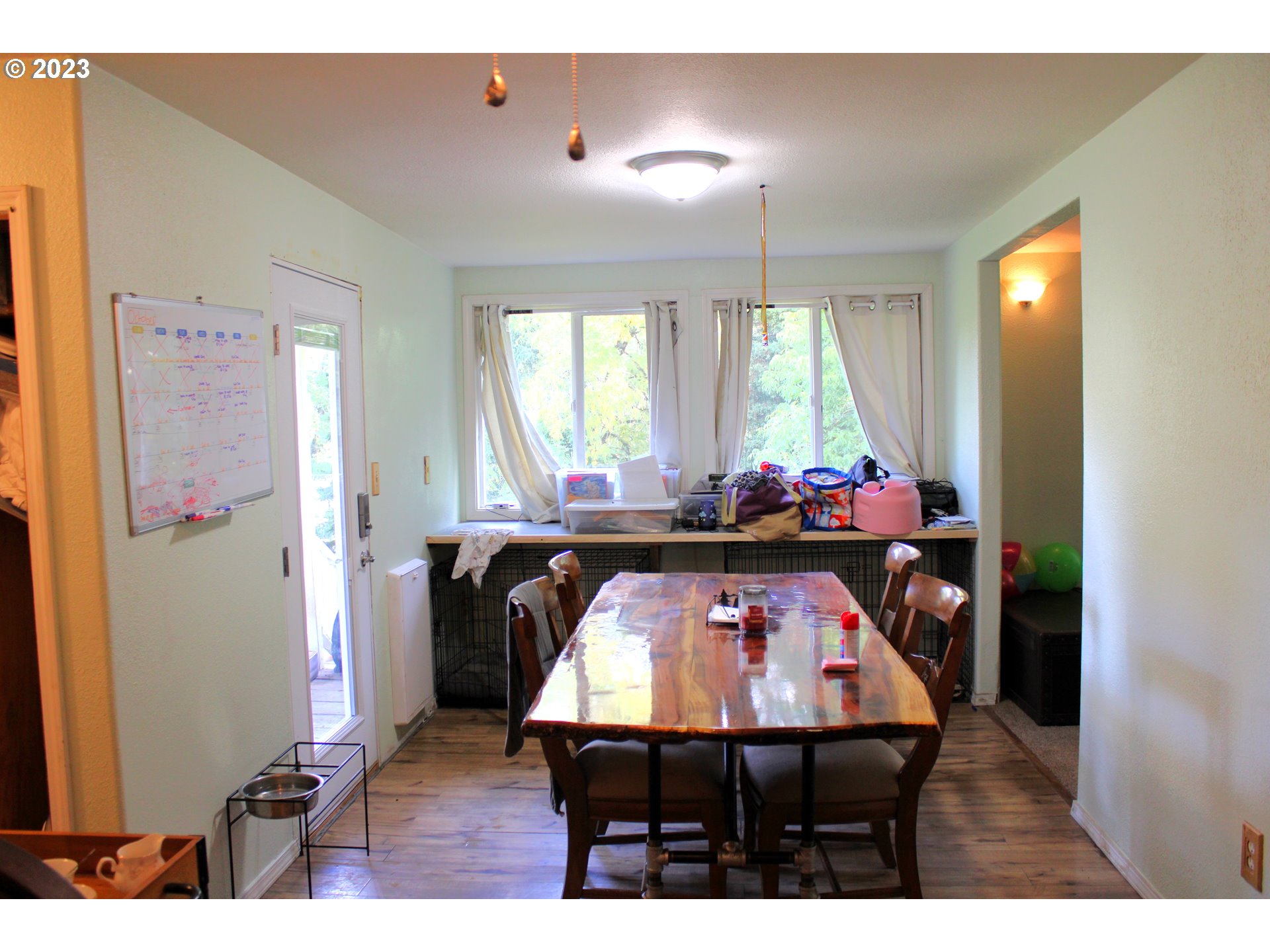 3392 Eagle Valley Road Yoncalla, OR 97499 - Photo 7 of 48 a view of a dining room with furniture and window