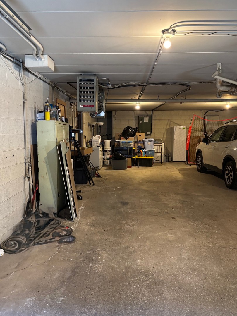 9132 South Pulaski Road, Unit 2E Oak Lawn, IL 60453 - Photo 19 of 22 a view of parking garage with cars
