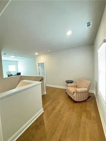 a view of an empty room and a window