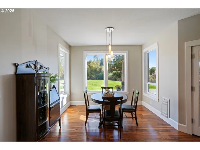 a view of a dining room with furniture window and outside view