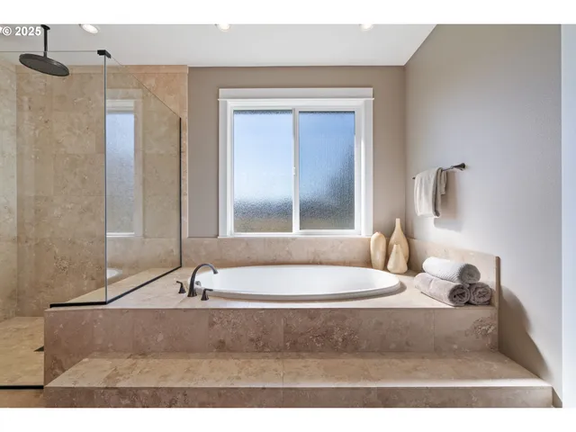 a bathroom with a bathtub and a sink