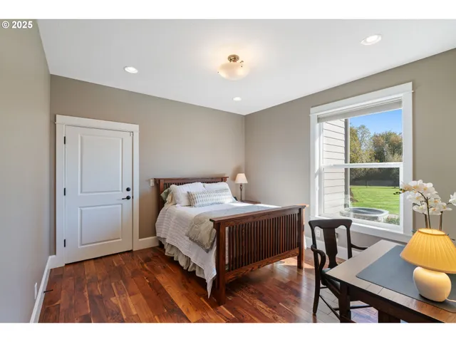 a bedroom with furniture and a window
