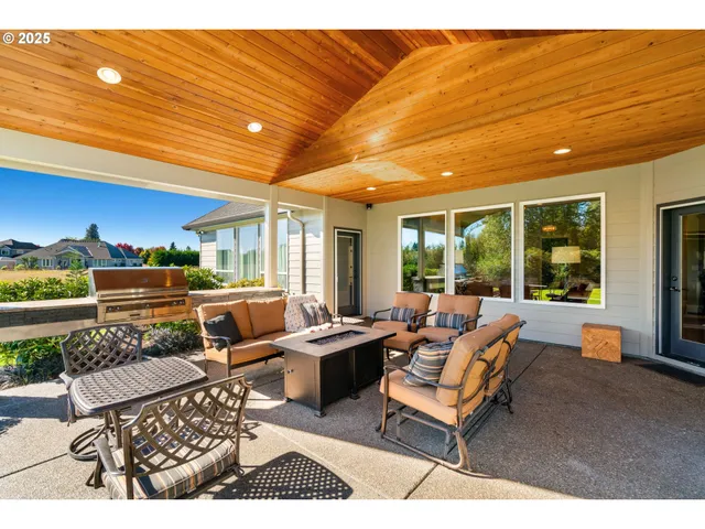a building outdoor space with patio furniture and potted plants