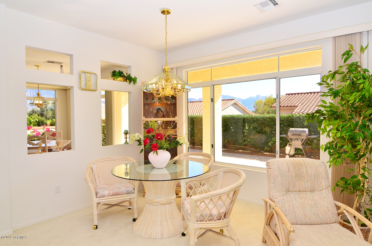 1330 East Crown Ridge Drive Tucson, AZ 85755 - Photo 10 of 22 a view of a dining room with furniture window and outside view