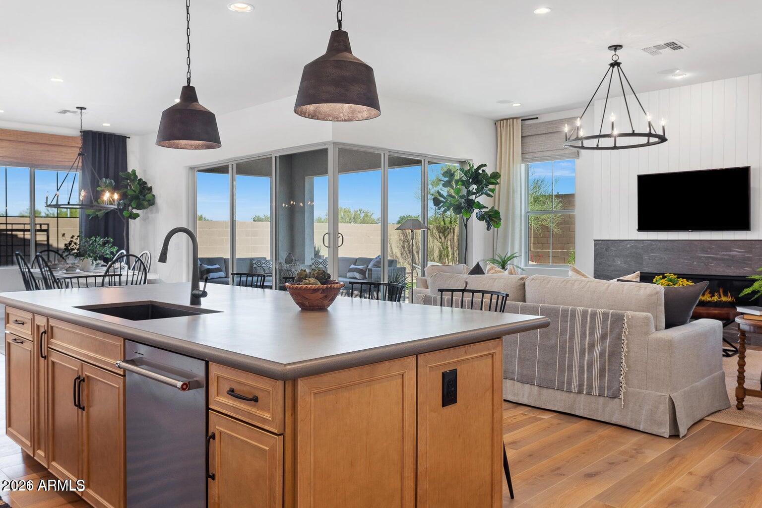 4412 East Roy Rogers Road Cave Creek, AZ 85331 - Photo 12 of 40 a kitchen with a counter space a sink and a chandelier