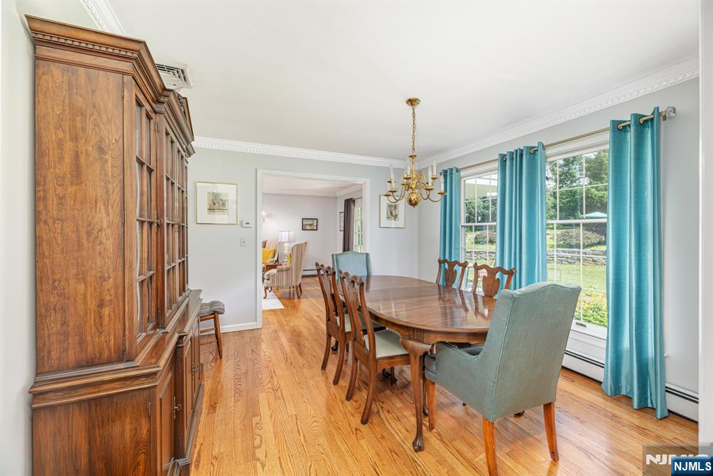 208 Willows Road Newton, NJ 07860 - Photo 15 of 44 a view of a dining room with furniture window and wooden floor